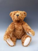 Steiff Teddy bear 1906 with reddish brown or cinnamon mohair and jointed limbs, 70cm tall,