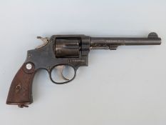 Deactivated Smith & Wesson six-shot revolver with moulded grips,