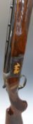 Browning 12 bore over and under shotgun with all over scrolling engraving and scenes of birds
