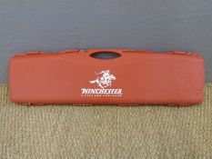 Winchester hard gun case with fitted interior and slide clasps, 97x27cm.