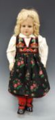 A 1930s felt doll, probably Norah Wellings for Chad Valley, blonde hair with glass eyes,