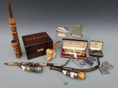 A quantity of smoking equipment including German pipes, Meerschaum example, lighters,
