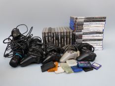 A collection of Playstation 1 and 2 games and controllers.
