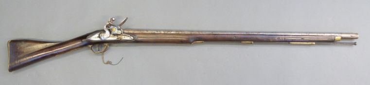 Thompson flintlock hammer action musket with Roman type lock named Thomson and engraved with a