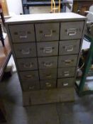 A vintage industrial style set of 15 metal drawers