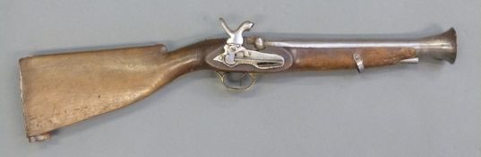 Percussion hammer action blunderbuss with engraved brass trigger guard,