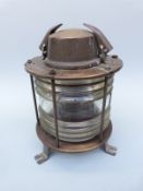 A brass or bronze ship's 'not under command' lamp with plate to top M.V.