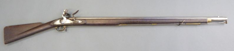 18 bore flintlock hammer action gun with brass trigger guard, butt plate and mounts,