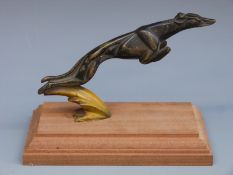 A painted bronze greyhound car mascot,