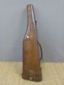 Brown leather leg of mutton gun case with brass lock, carry handle and sling suspension loops,
