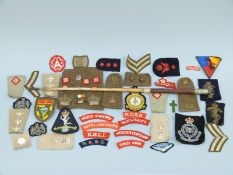 A collection of cloth insignia,