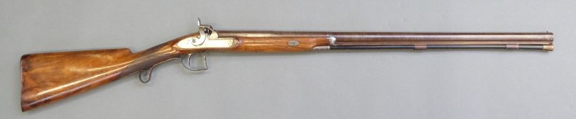 Stevens 12 bore single barrelled percussion hammer action shotgun with engraved lock,