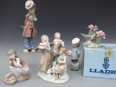 A collection of Lladro figures to include seated girl with basket of flowers, boy with football,