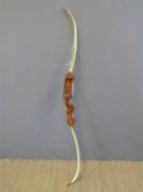 Pro Hoyt Medalist archery bow with layered wooden handle in leatherette carry case.