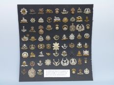 A display of 68 WWI regular infantry military cap badges on card,