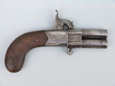 Percussion hammer action over and under pistol with engraved locks, folding trigger,