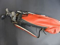 A set of Mizuno golf clubs in bag