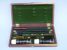 Aguinaga gun cleaning kit in original felt lined fitted wooden box.