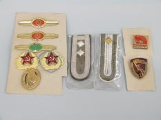 A collection of former USSR badges etc