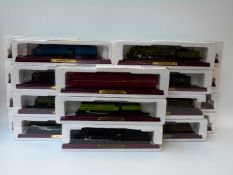 Twenty-two 00 gauge static model locomotives on wooden plinths,