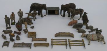 Over 30 Britains and similar lead model animals including elephants, penguins etc,
