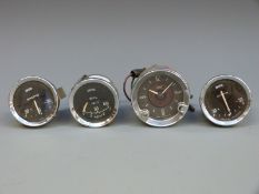 Four Smiths classic car gauges including ammeters,