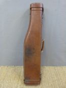 Brown leather leg of mutton gun case with buckle fastening to both ends,