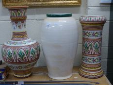 A continental jardiniere stand and a large bulbous vase,