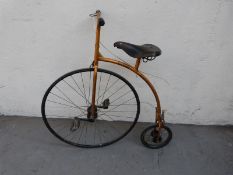 A child's bicycle formed as a Penny Farthing or Ordinary with Middlemore leather saddle