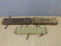Three canvas and leather gun cases, two with brass fittings,