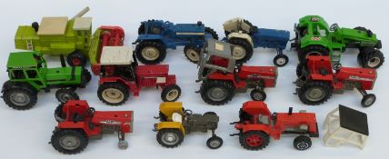 Eleven Britains and similar diecast and plastic model tractors including Massey Ferguson, Ford,