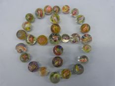 Twenty nine glass marbles,