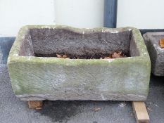 A rectangular carved natural stone trough (L88 x W50 x H35cm)