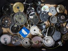 A large collection of fishing reels including trout,