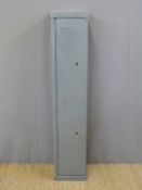 A gun / ammunition cabinet with two sets of keys.