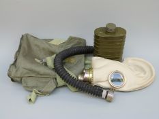 A cased soviet cased gas mask,