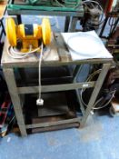 A workshop stand with bench grinder and two surface plates