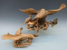 Two Singapore root carvings of birds of prey