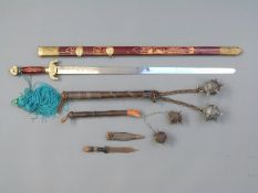A decorative replica Chinese sword in scabbard, blade length 70cm,