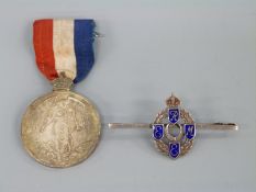 A silver REME sweetheart brooch set with blue enamel and a medal for the Imperial Choir Founded