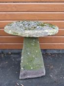 A natural stone staddle stone with unusually large top,