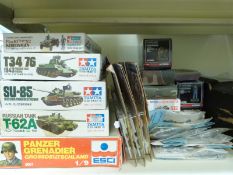 Twenty-nine Tamiya, ESCI, Airfix, Corgi and similar model soldiers and tank kits,