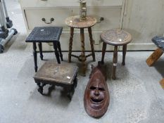 Four carved stools,