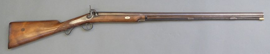 Percussion hammer action gun with indistinctly named and engraved lock,