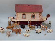 A Noah's Ark and wooden animals, approximately H32 x L65cm,