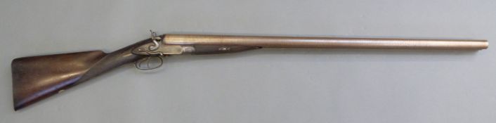 W Wellington (W W Greener) 8 bore side by side hammer action shotgun with named and ornately