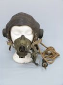A WWII flying helmet, mask,