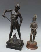 Two bronzed figures,