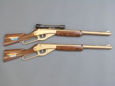 A pair of Daisy Golden Eagle Winchester underlever style air rifles, one with original scope,
