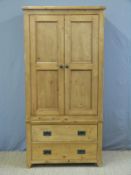 A pine wardrobe with two drawers under (H190 x W95 x D54cm)